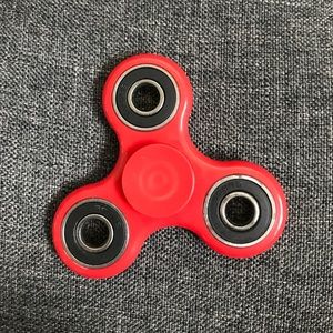 Fidget spinner. Red color. Comes with box.