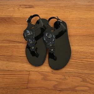 Black Coach Haylee jelly sandals.