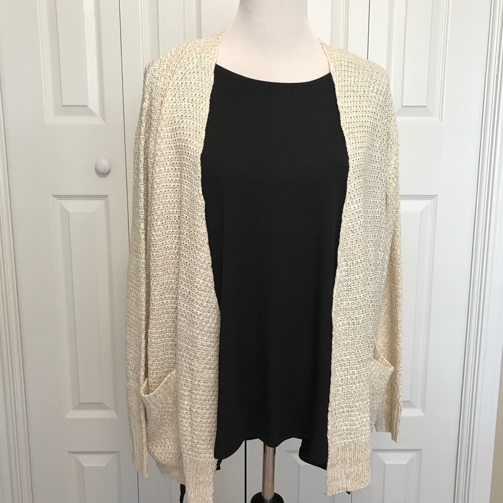 BRAND NEW. Classic ivory cardigan.