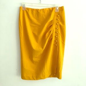 Yellow colored skirt with button design