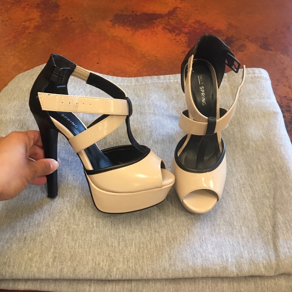 Cream and Black four inch heels.