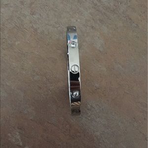 Silver love bracelet with stones.