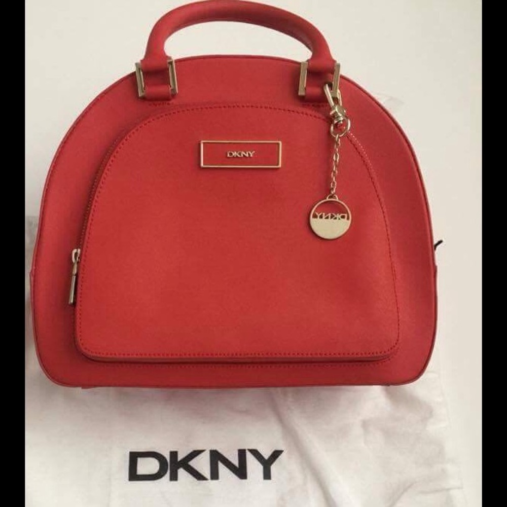DKNY Saffiano round pocket satchel bag.