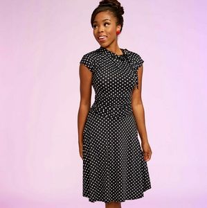 Black and white polka dot 1940s-style swing dress