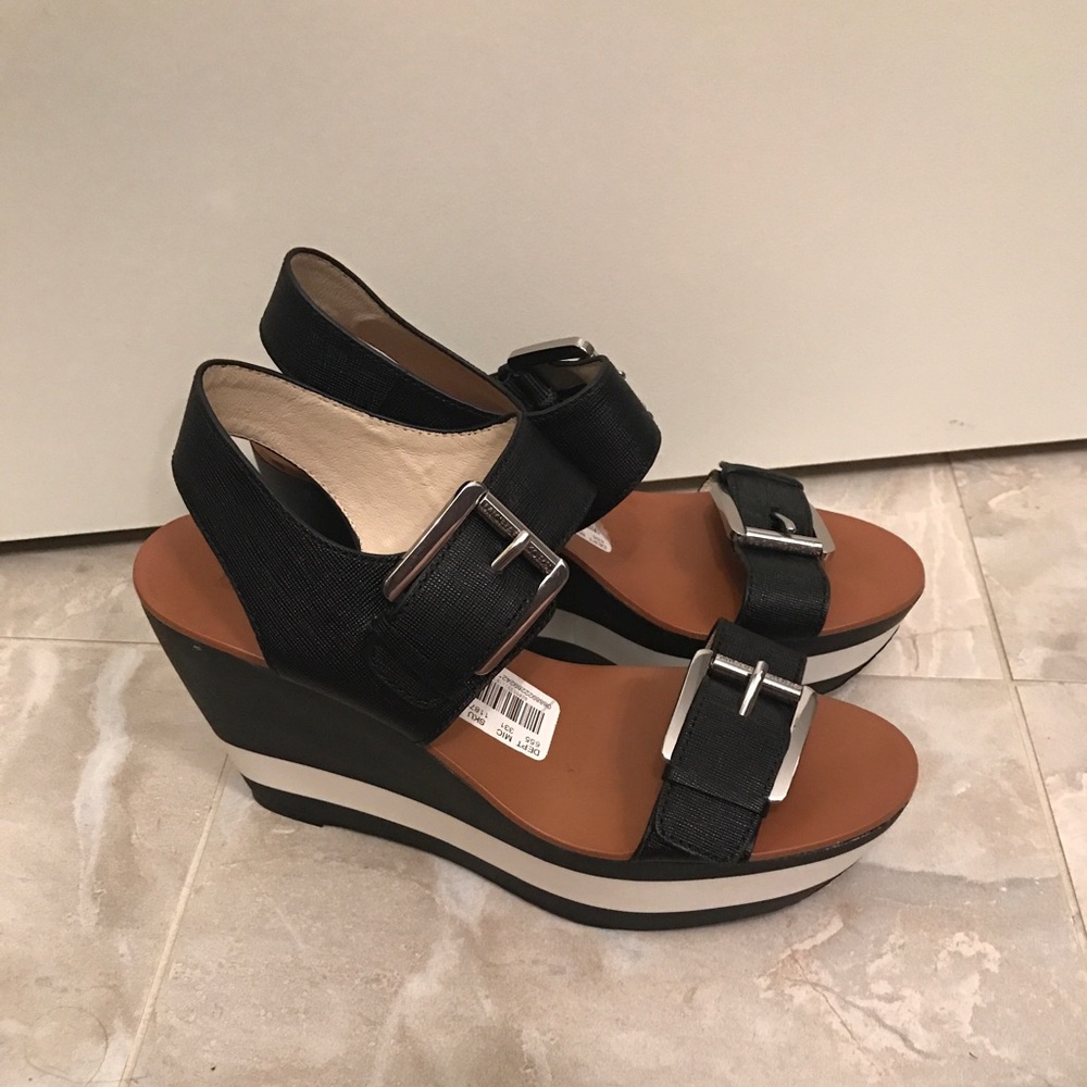 Brand new Michael Kors black and white sandals.