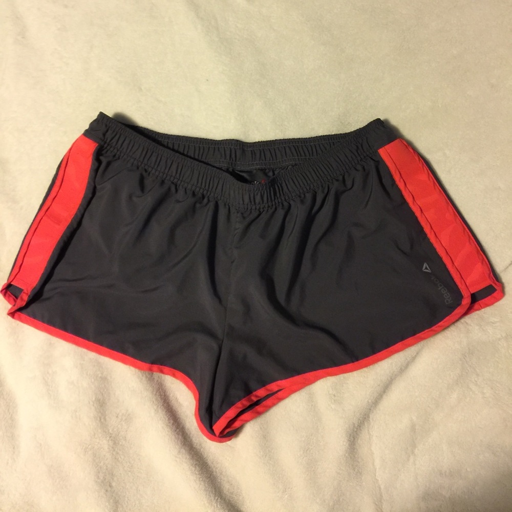 Reebok dark gray and orange shorts - large