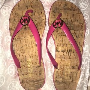 Pink Michael Kors flip flops