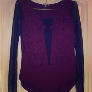 raspberry colored BODYSUIT. Black mesh sleeves