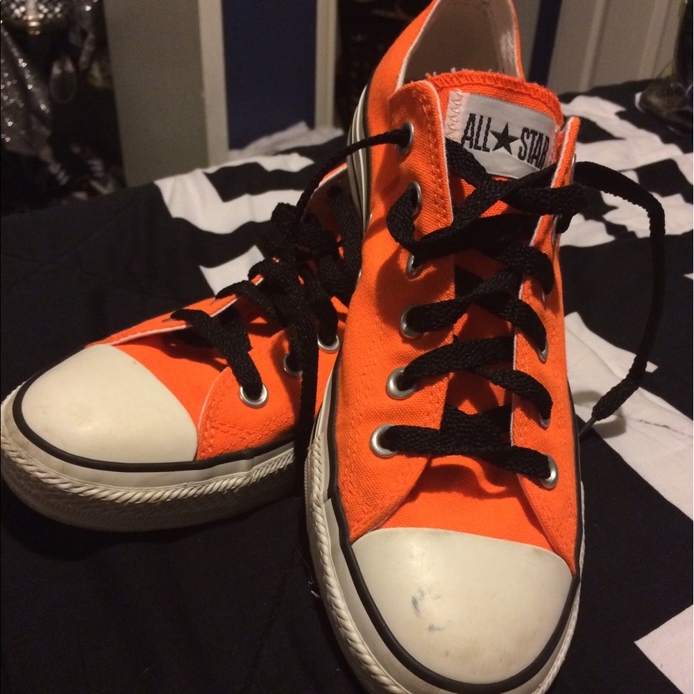 Neon orange Converse low top chuck Taylor sneaker