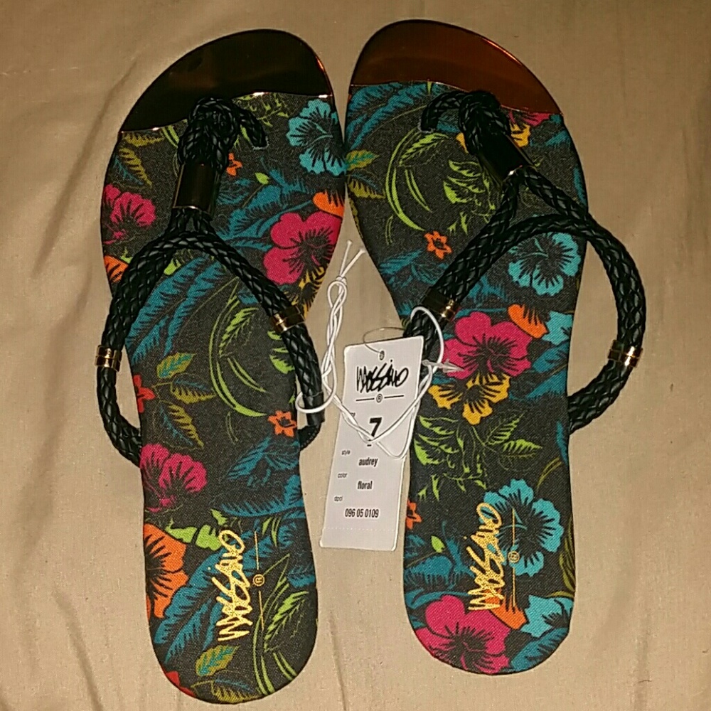 Beautiful multi color flowered sandals. Never worn