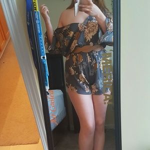 Floral off shoulder dark grey romper.