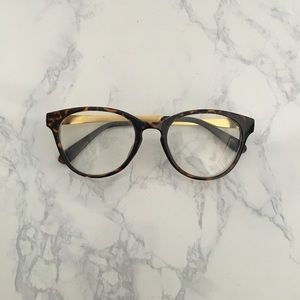 Tortise eyeglasses with gold siding