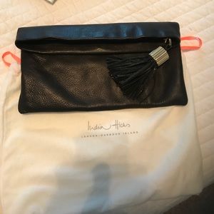 Black leather clutch handbag