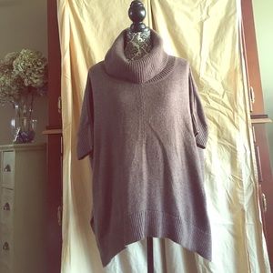 Three quarter sleeved turtleneck sweater