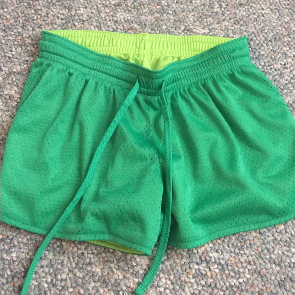 Green mesh athletic shorts