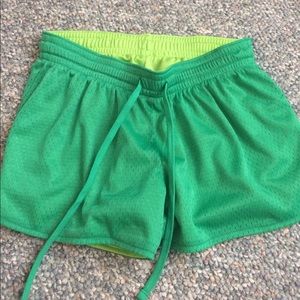 Green mesh athletic shorts