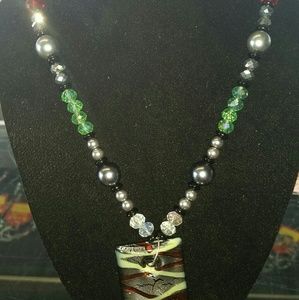 Handmade blown glass necklace.