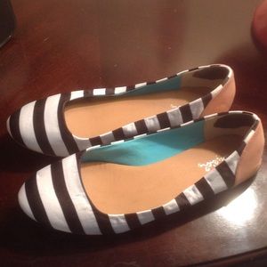 Black and white striped flats