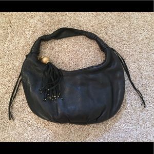 Black leather purse with fringe detail