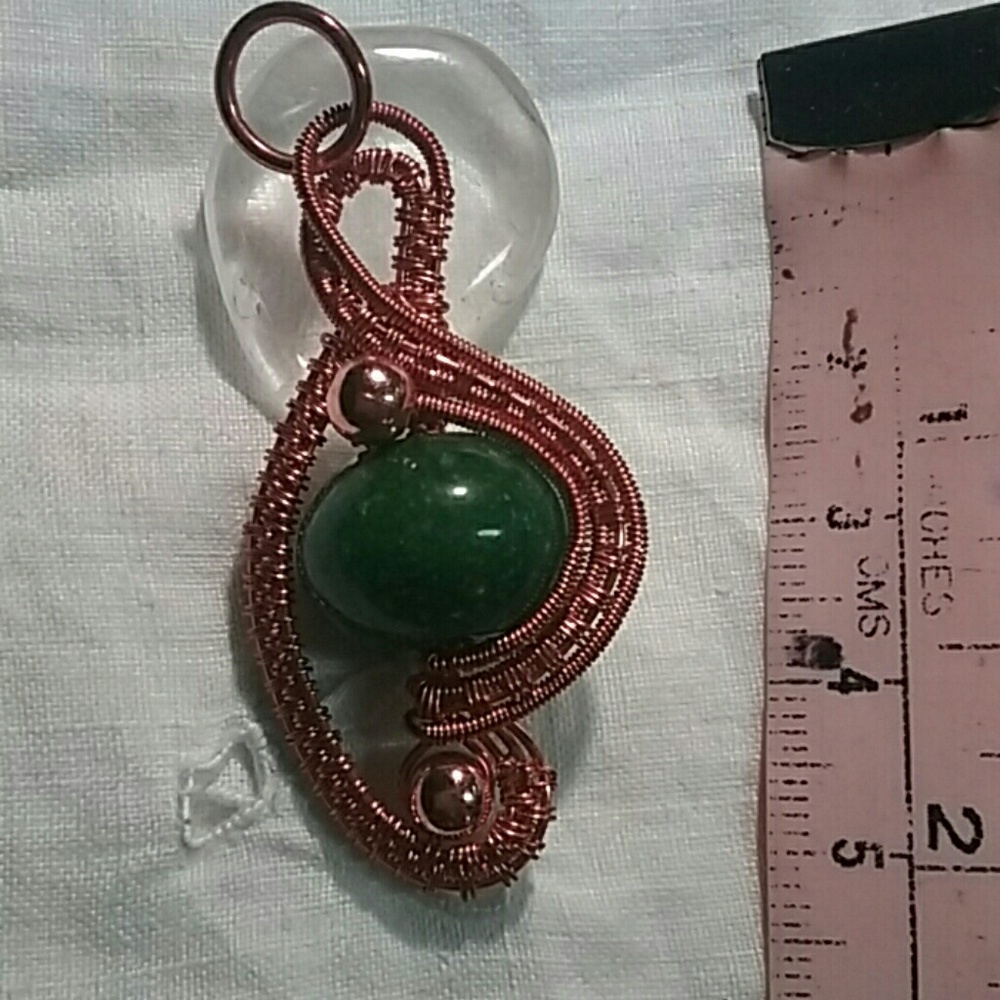 Jade in copper wire weave pendant