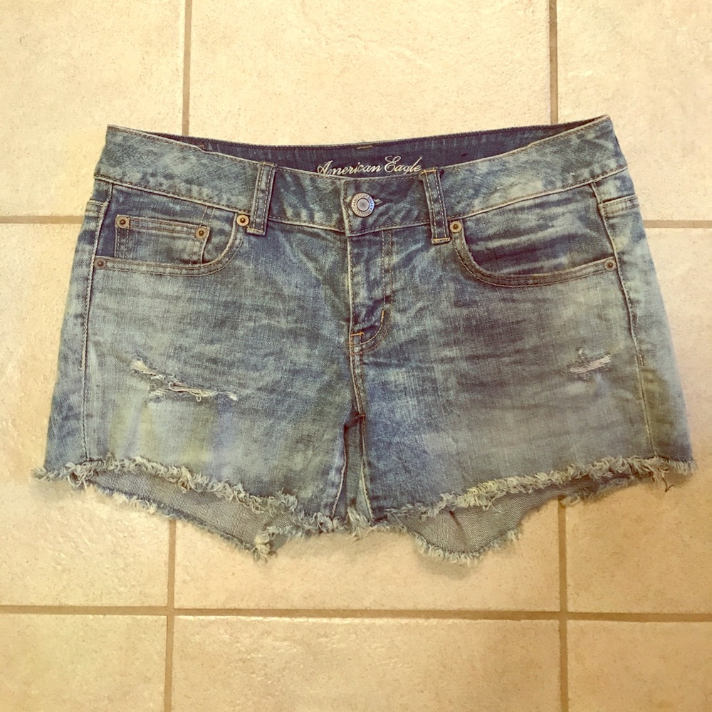 Acid washed frayed jean shorts