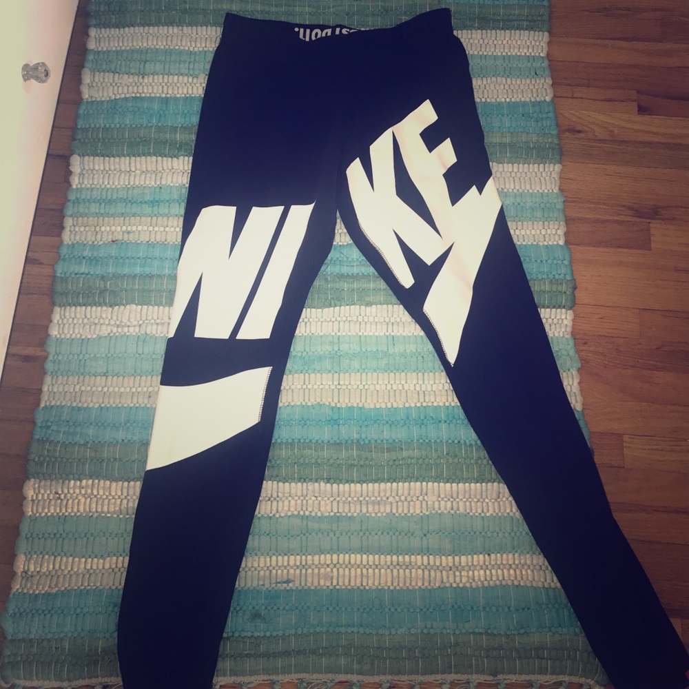 Black Nike work out leggings with white logo.