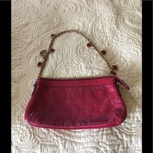 Small Red Gucci purse with heart charm strap