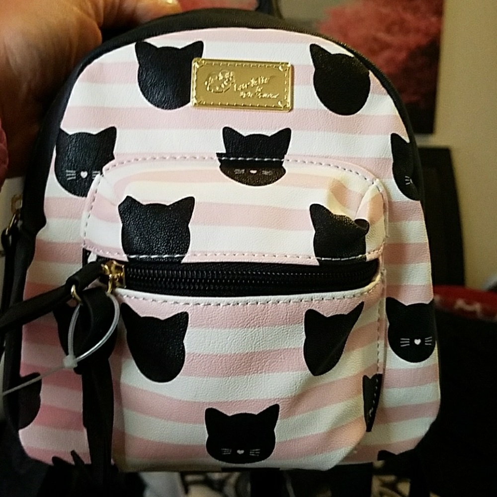Betsy Johnson mini backpack with kitty plush.