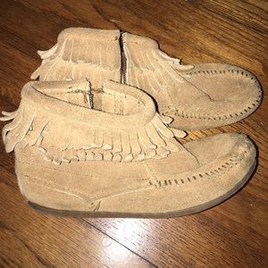 Girls Minnetonka boots.