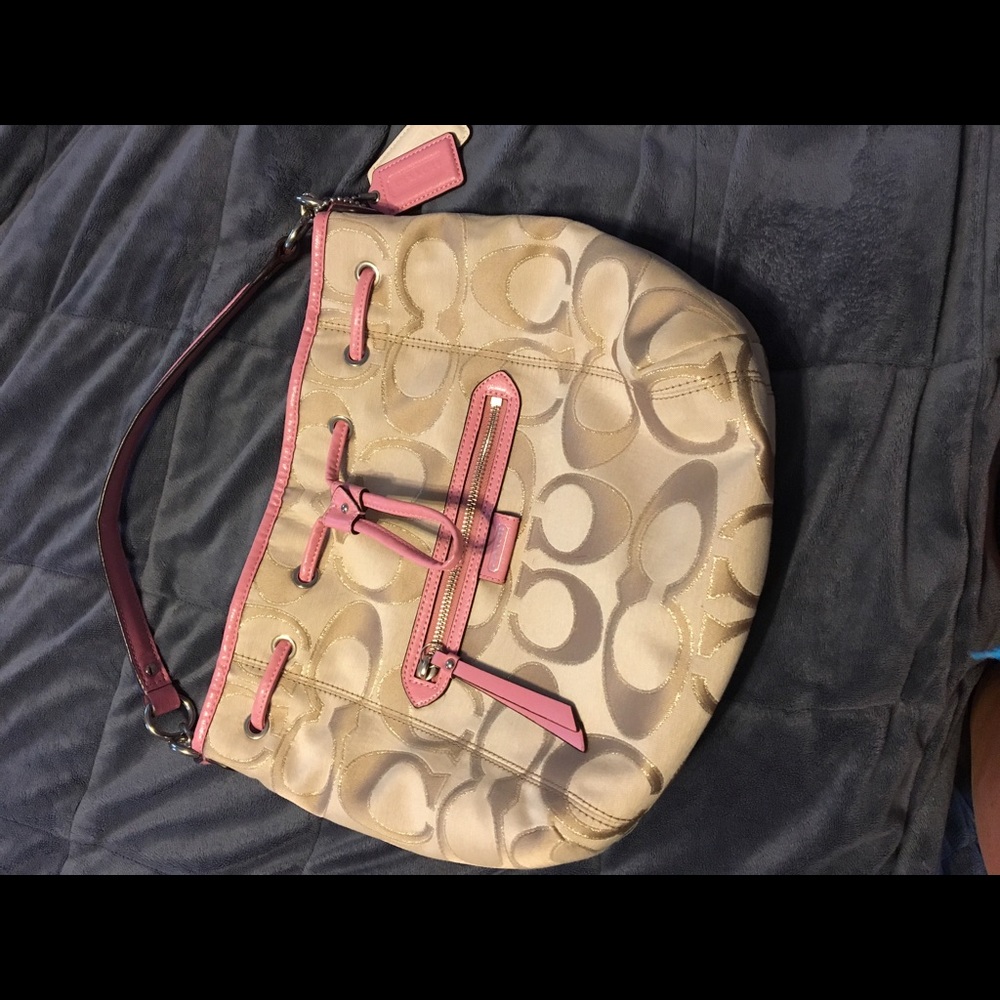 Beautiful gold and pink authentic Coach purse