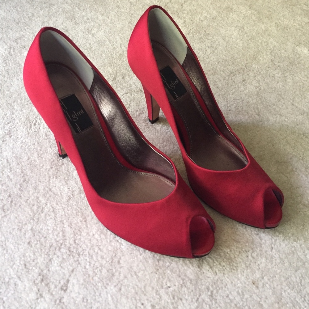 Red satin peep toe pumps
