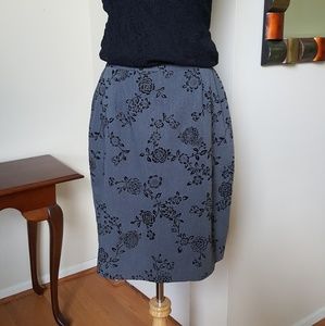 Grey skirt with black flower detail.