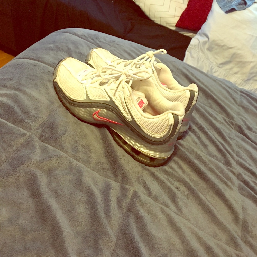 White and pink Nike running shoes