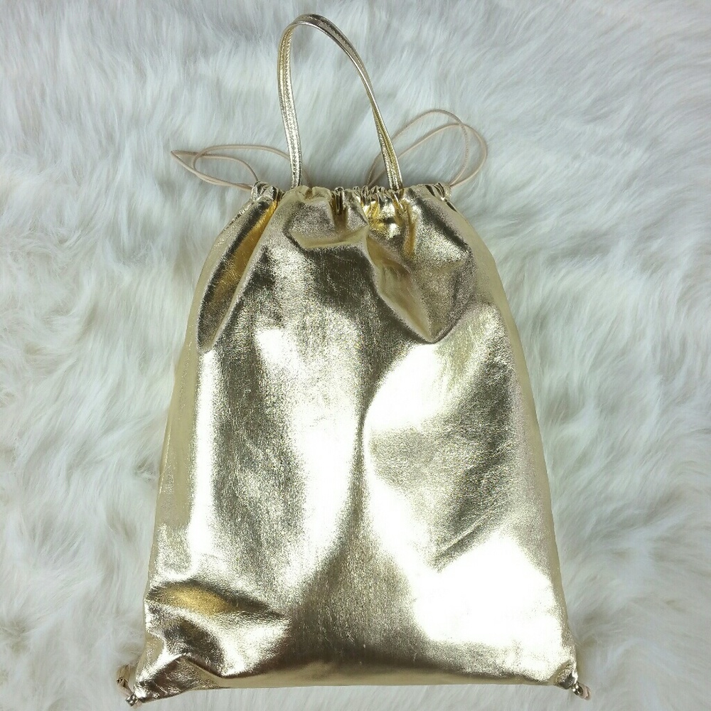 KARA drawstring-close gold leather backpack