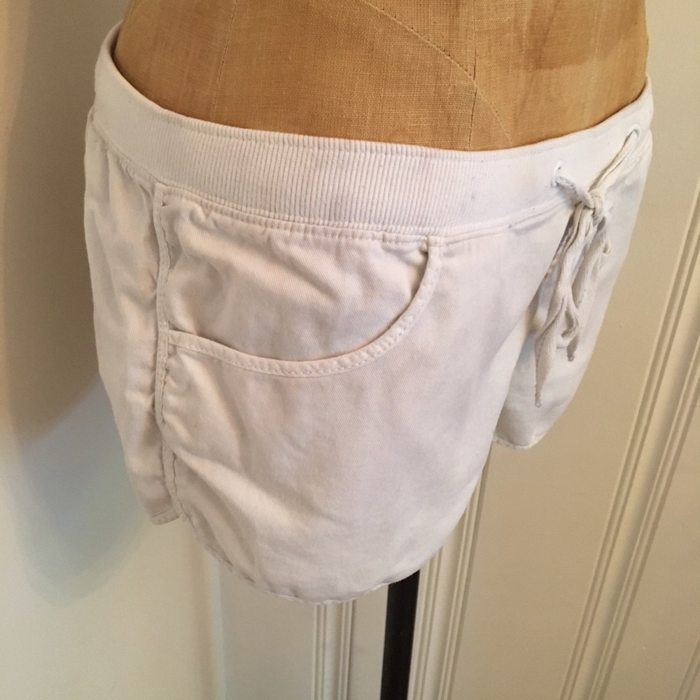 Dolphin hem lightweight white drawstring shorts
