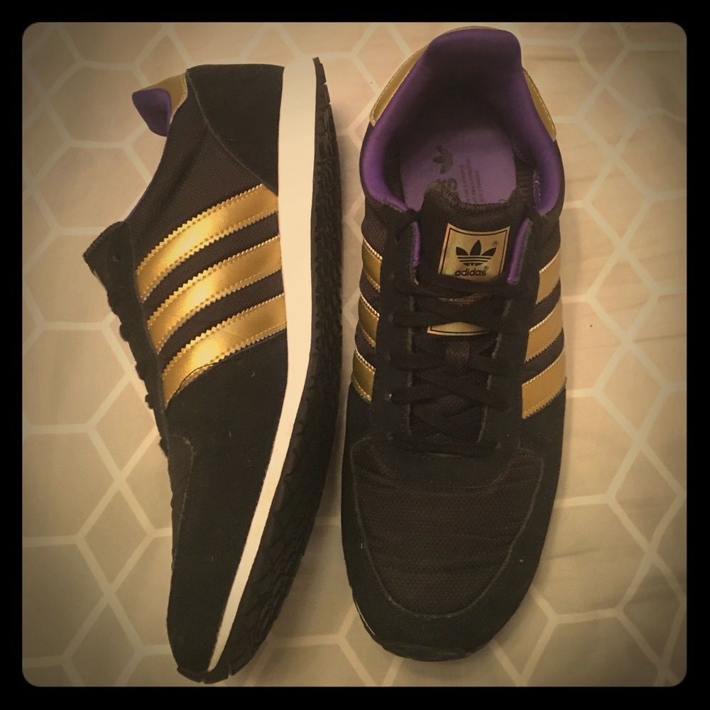 Black, gold, and purple tennis shoes