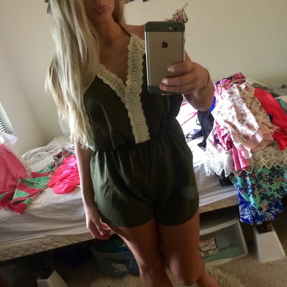 Green romper with cream crochet trim