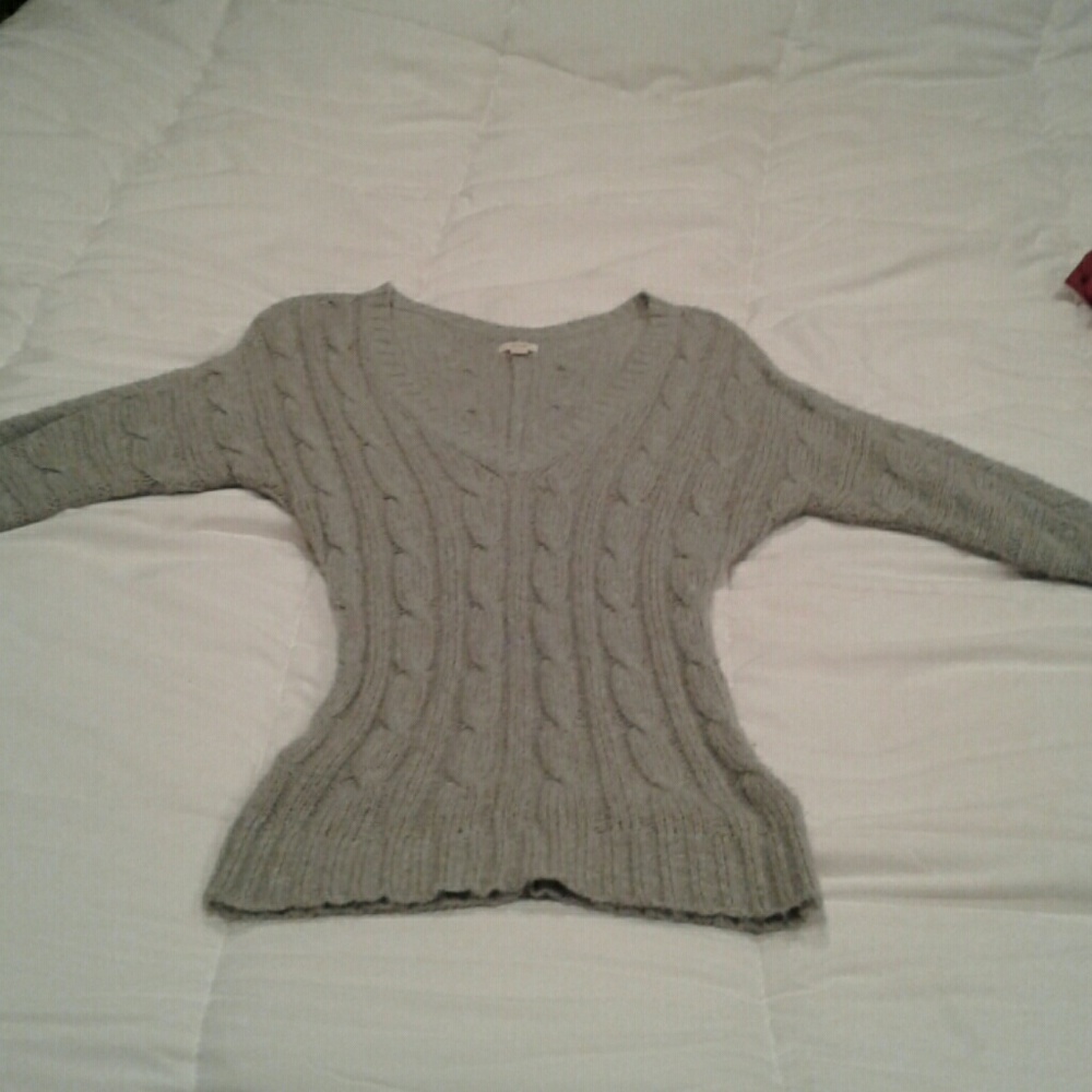 Form fitting sweater
