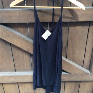 Beach cover up.  Black- T strap. Tag on