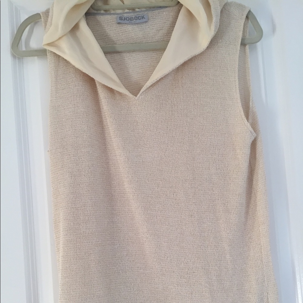 A sleeveless gold shimmer hoodie