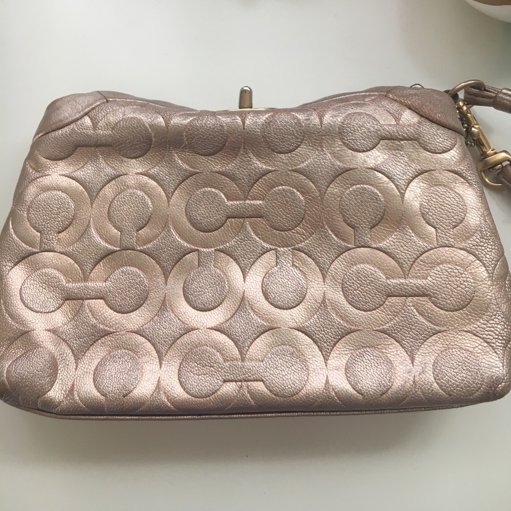 Coach rose gold wristlet