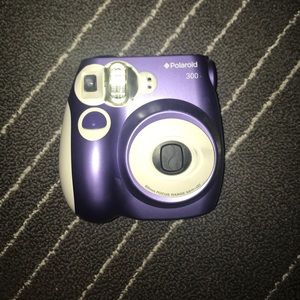 purple polaroid camera with 6 film