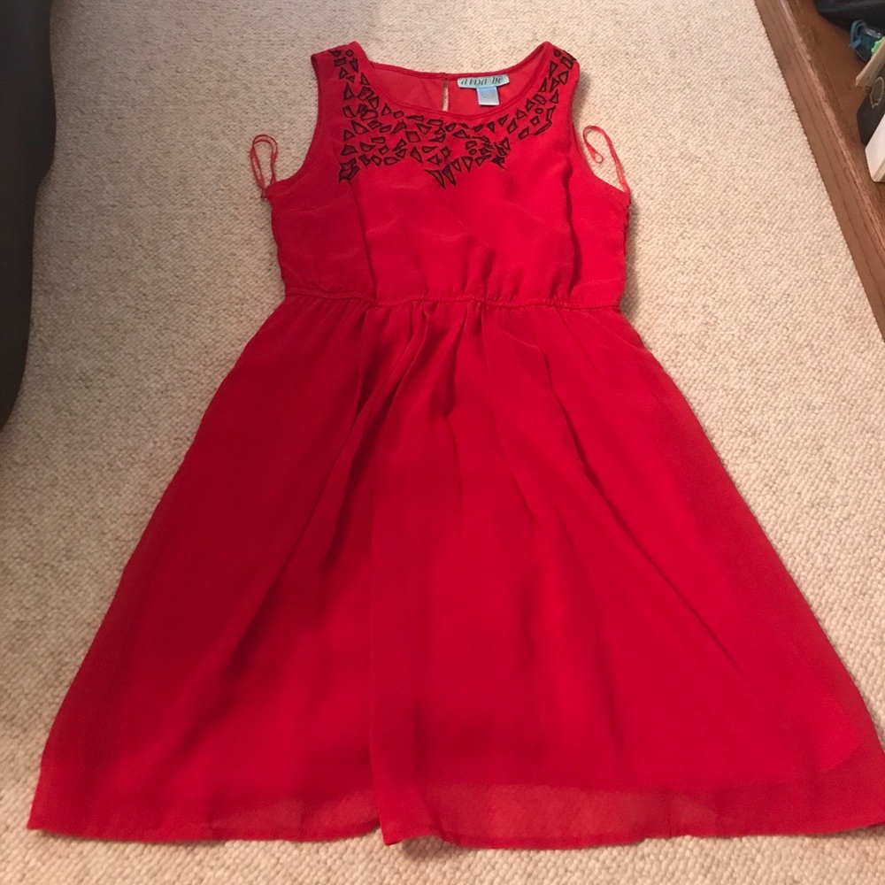 Red dress by boutique brand Dina be