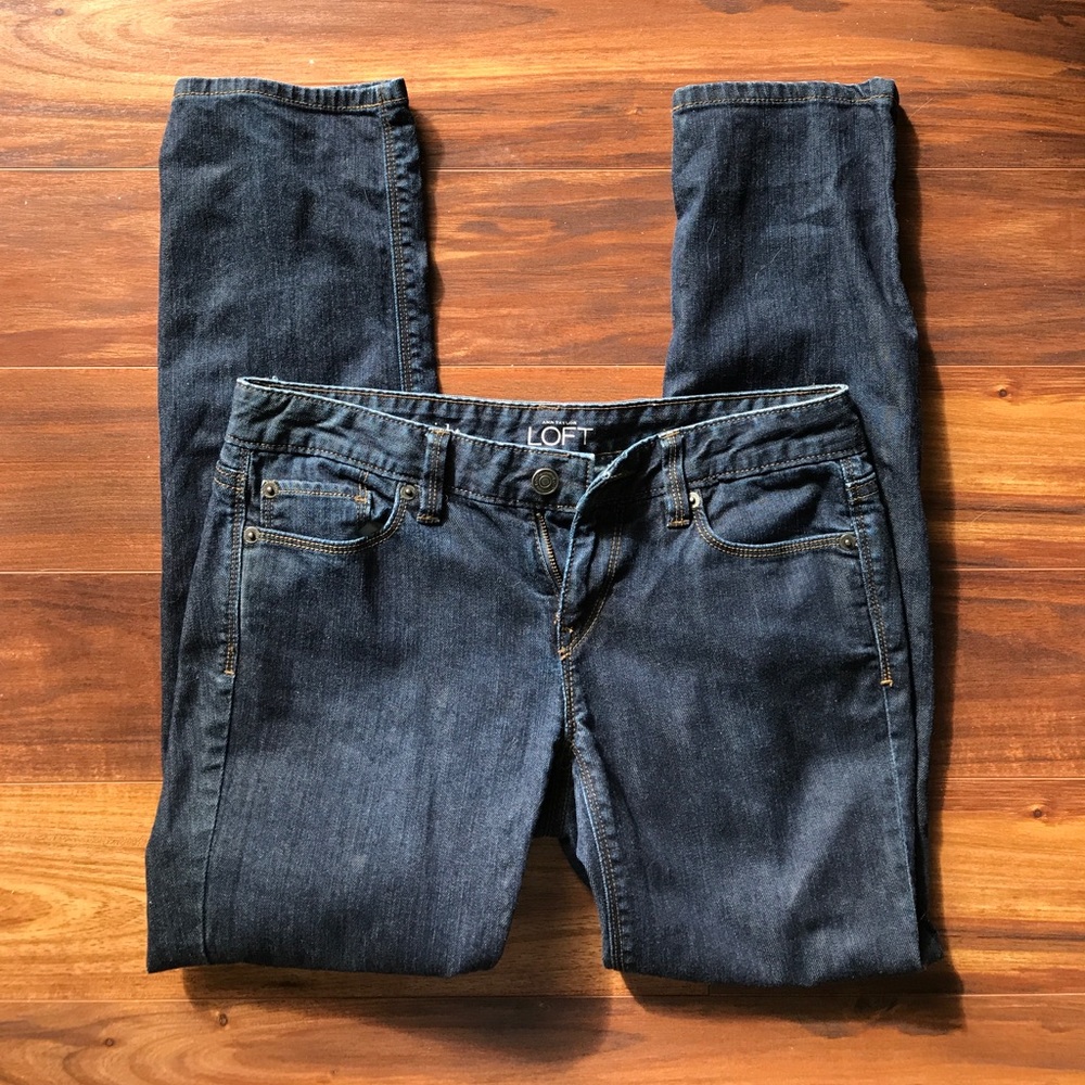 Straight leg dark wash jeans.