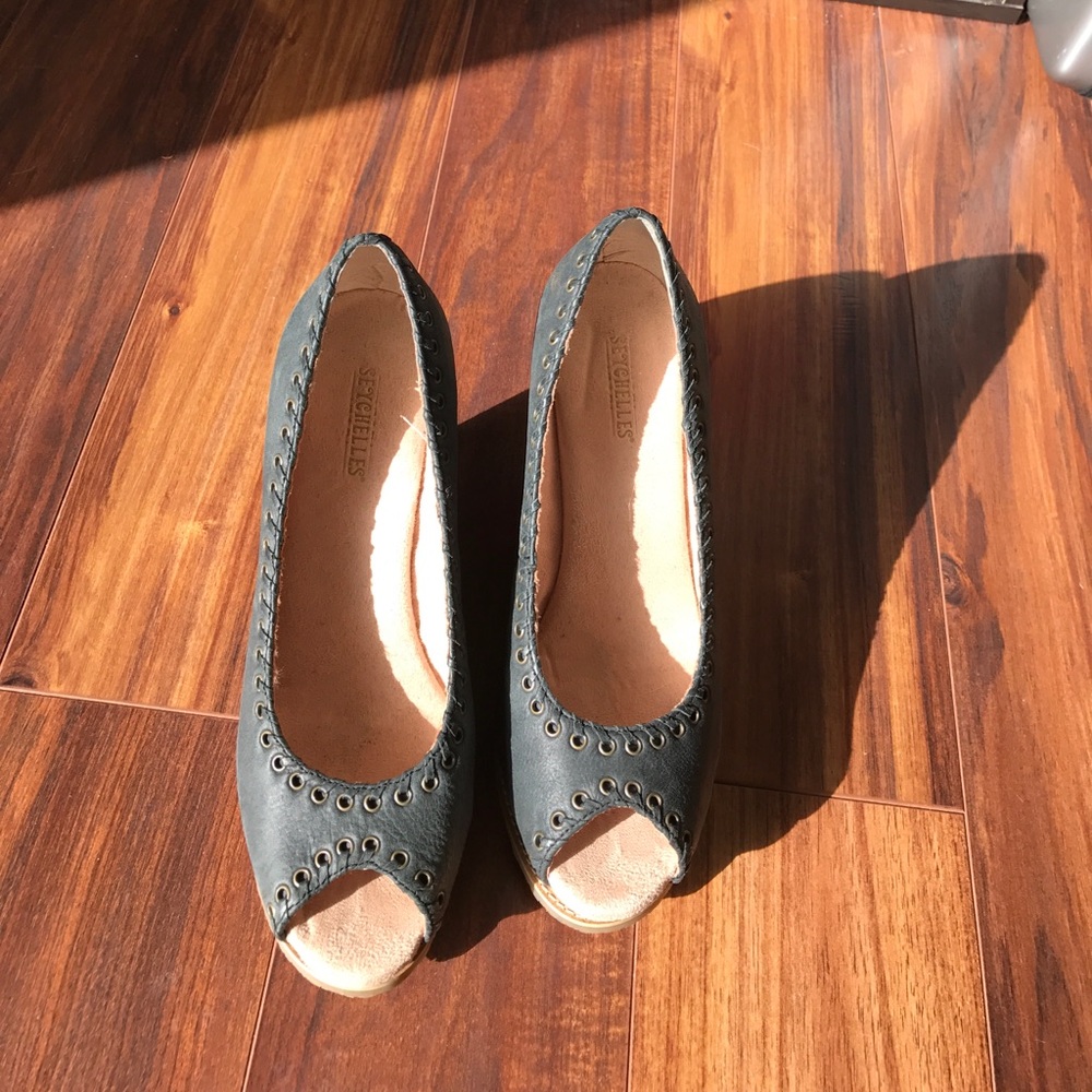 Dark grayish blue peep toe wedges.
