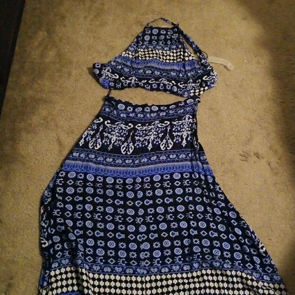 Halter top with long skirt showing off stomach.