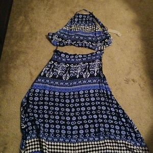 Halter top with long skirt showing off stomach.