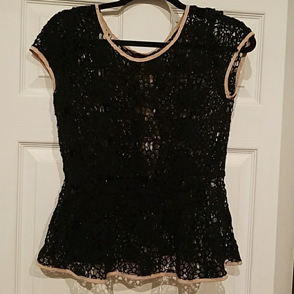 Black cap sleeve shirt with tan bows down back.