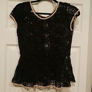 Black cap sleeve shirt with tan bows down back.