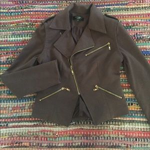 In vogue jacket with asymmetrical zippers